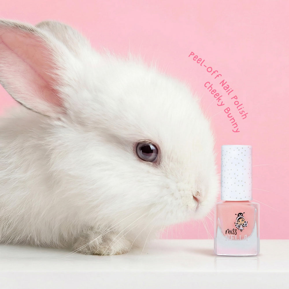 MISS NELLA brush applying light pink polish demonstrating easy, smooth coverage benefit