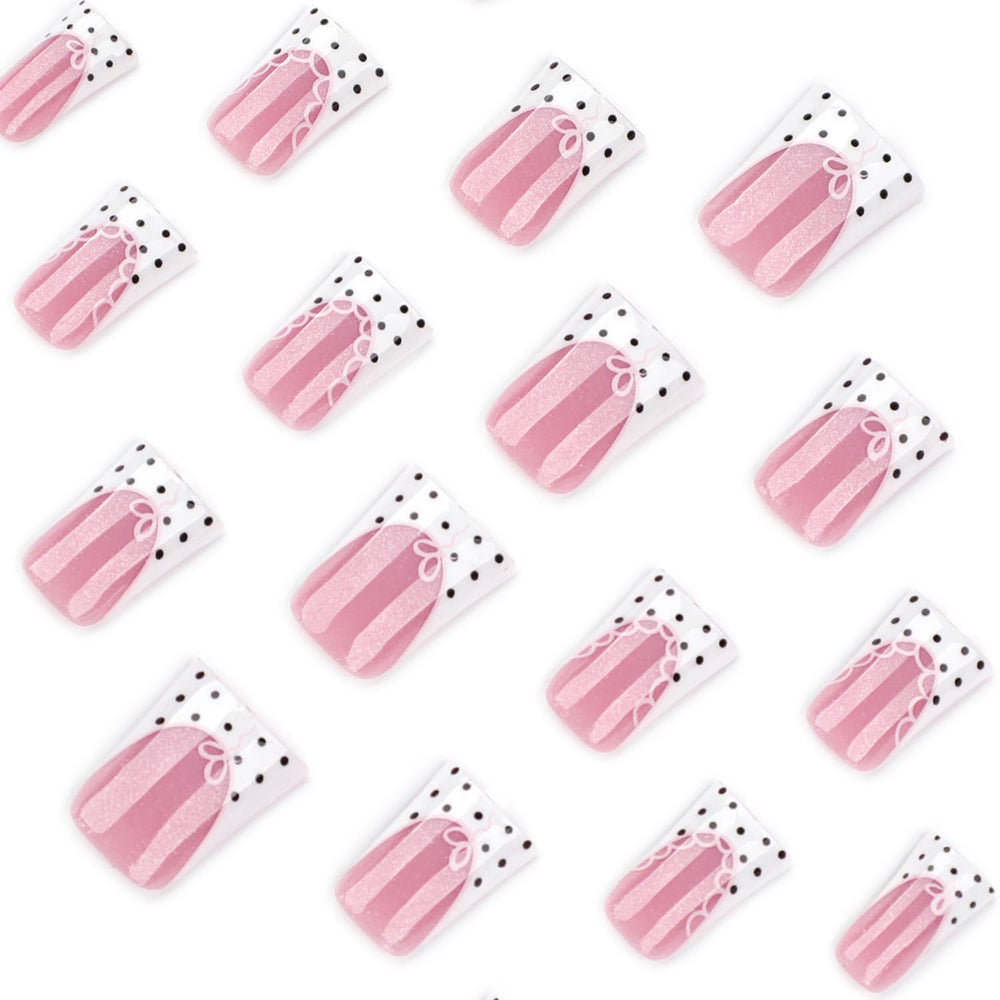 Mivota detail of white French tip with black polka dots and lace outline for stylish contrast