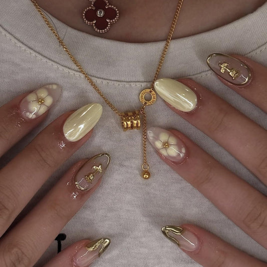 Mivota front packaging showing yellow floral almond nails and elegant set appeal