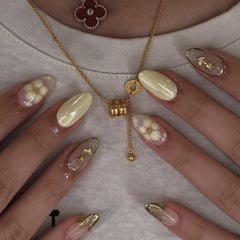 Mivota front packaging showing yellow floral almond nails and elegant set appeal