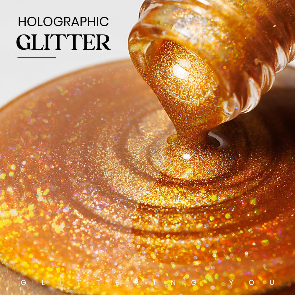 MIZHSE brush stroke of gold glitter polish demonstrating smooth application benefit
