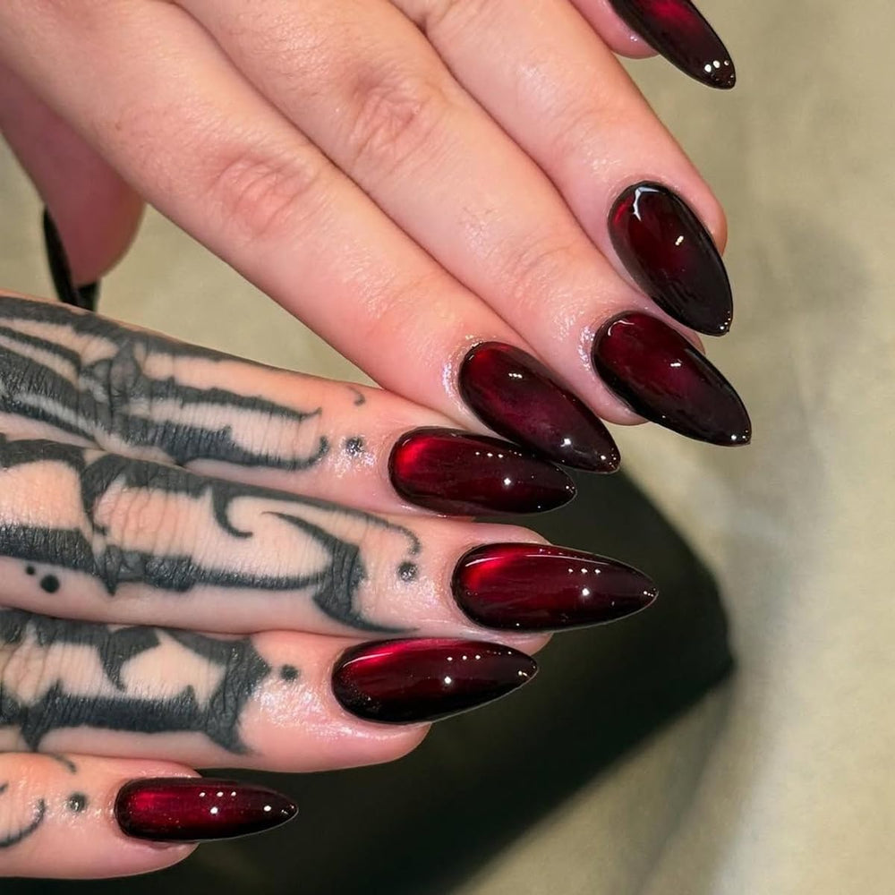 MJJNTTN side profile of a medium almond press-on nail showing elegant tapered fit