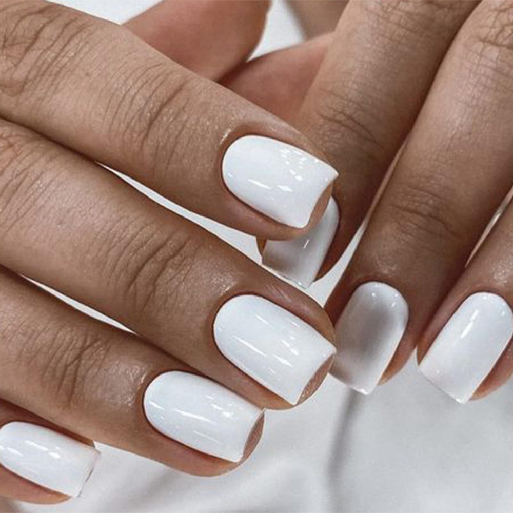 modelones close-up of short square pure white nail texture and finish