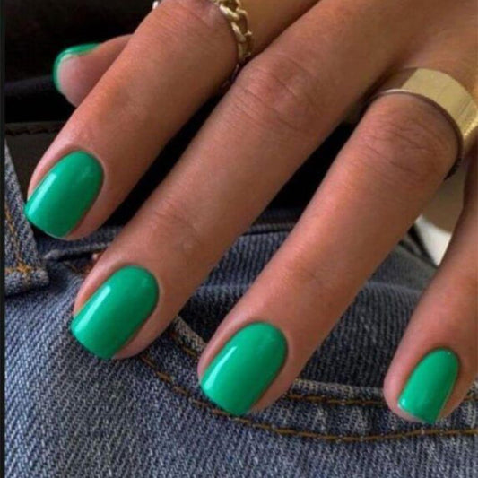 modelones front packaging showing green press-on nails and kit, clear contents benefit