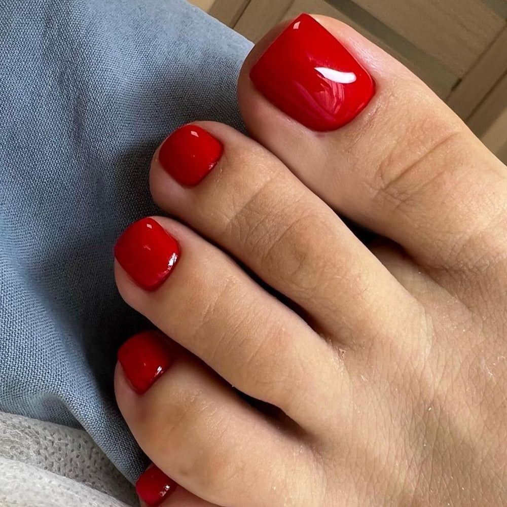 modelones front packaging showing red square press-on toenails and kit benefits
