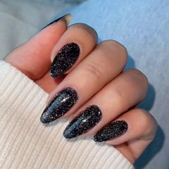 modelones front pack showing sparkle black almond nails and kit benefits