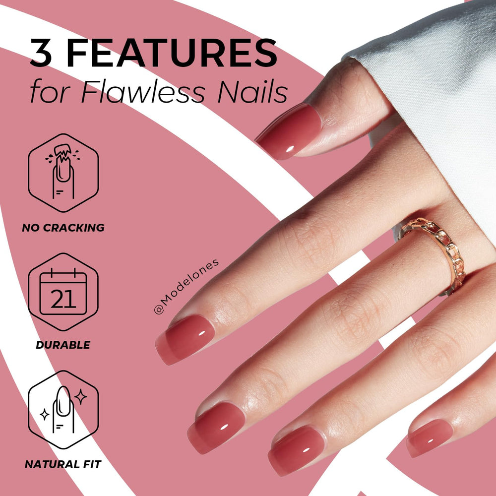 modelones rose red hand in use applying a press-on nail for quick application