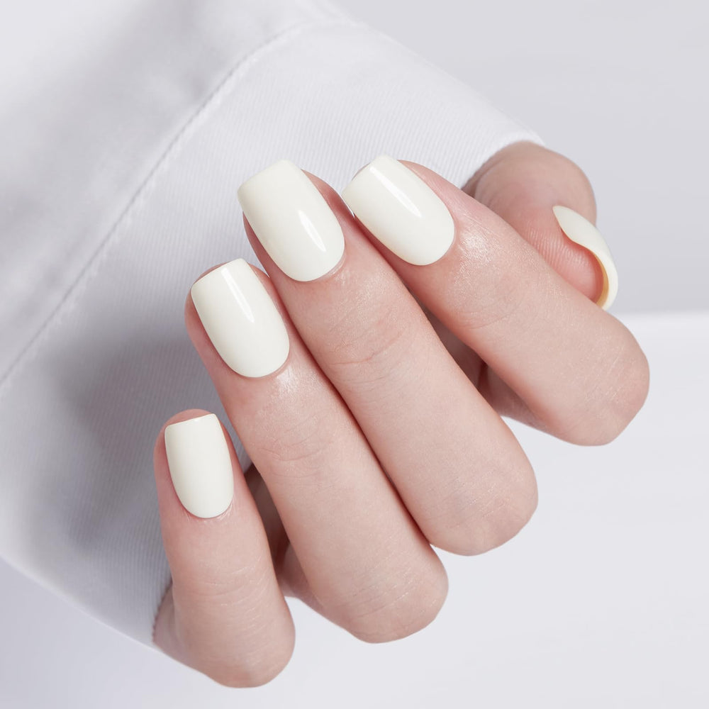 Modelones close-up of milky white short square nails highlighting smooth finish