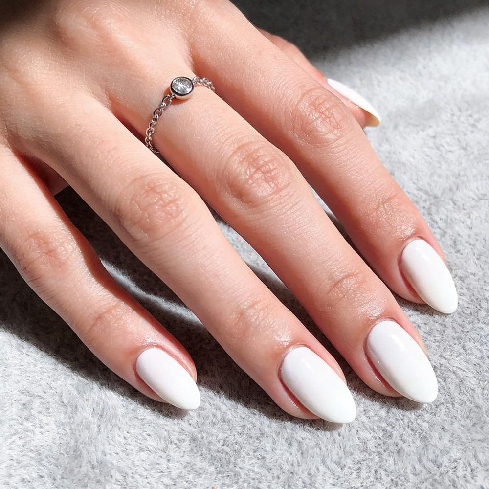 modelones array of 32 white almond press-on nails highlighting size variety