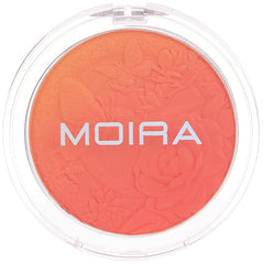 Moira blush swatch on arm in sunlight showing true Orange Blossom payoff and buildable warmth