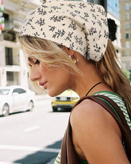 Molans scarf held in hand illustrating size and adjustable fit