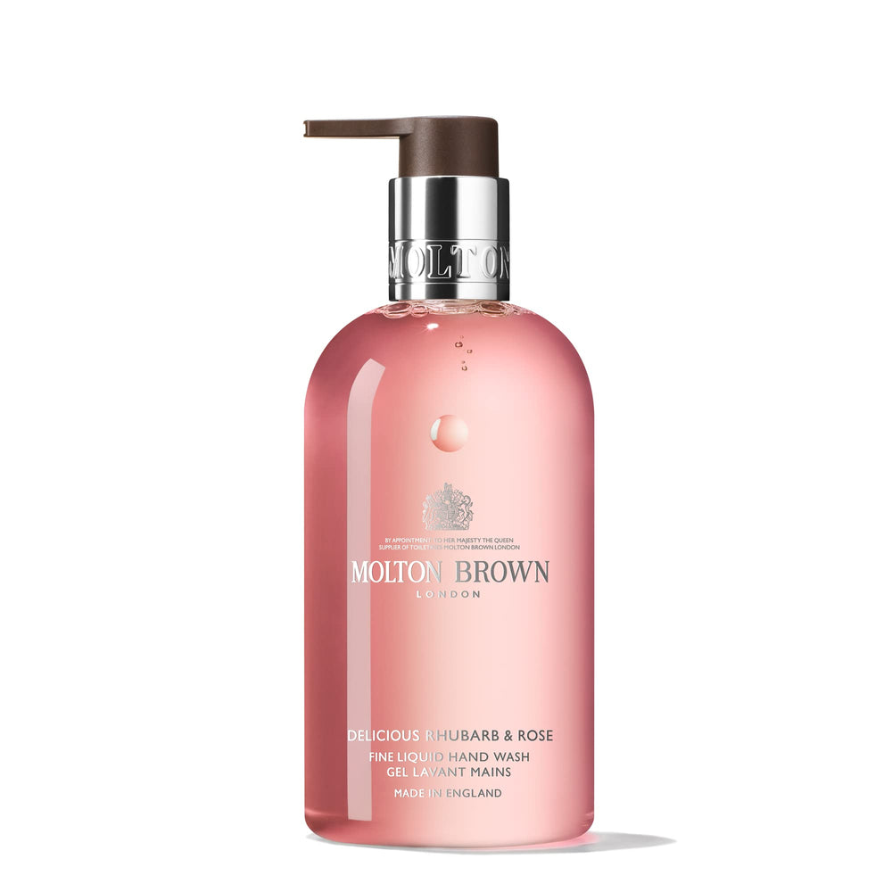 Molton Brown bottle front view showing label and elegant pump for refined cleansing