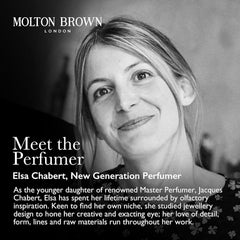 Molton Brown bottle in hand shows 10 fl. oz. scale and travel-friendly size