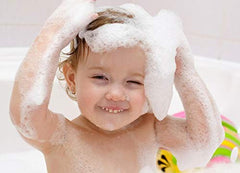 Moneysworth & Best child playing with foam showing playful bath engagement