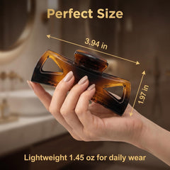 Morhom clip in hand to show compact size and travel-friendly benefit