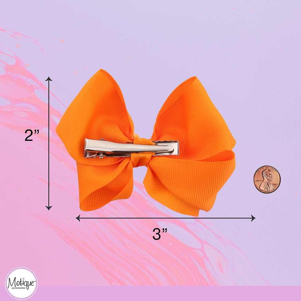 Motique Accessories orange bow worn by child demonstrating cheerful outfit pop