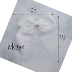 Motique Accessories bow worn in child's hair showcasing scale and styling