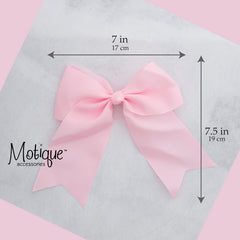 Motique Accessories bow beside ruler for size comparison benefit: clear scale of 7-inch width