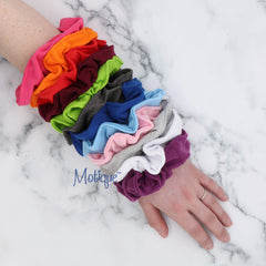 Motique Accessories scrunchie beside ruler showing 5.5 inch outer diameter for fit