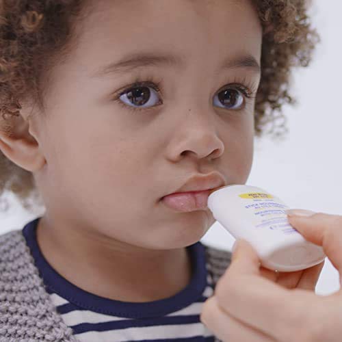 Mustela nourishing stick being applied to baby cheek for gentle soothing