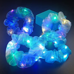 MUYANN scrunchie held in hand to show compact size and portability
