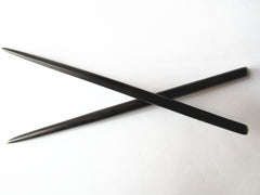 Myhsmooth front view of two hair sticks showing shape and length for secure hold
