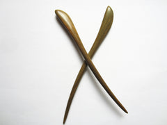 Myhsmooth hair bun with sticks in place demonstrating secure, elegant hold