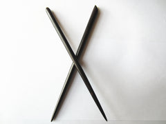 Myhsmooth wood grain texture of ebony stick showing smooth finish and durability