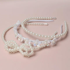 naibirdr pearl bow closeup showing delicate pearls and elegant look