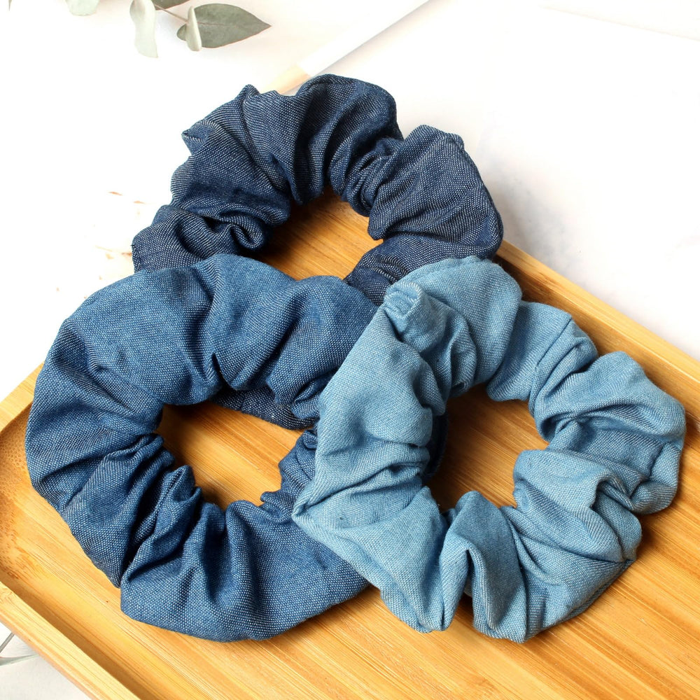 naibirdr scrunchie beside ruler for size comparison clarifies stretch and fit