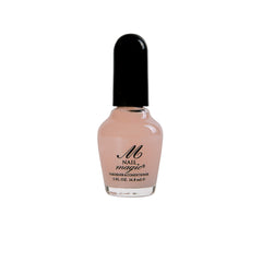 Nail Magic next to ruler showing 0.5 fl oz size for travel convenience