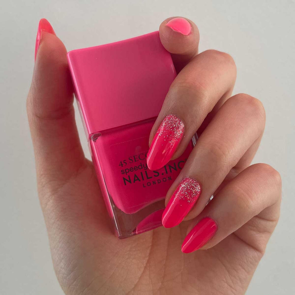Nails Inc swatch of Blake on wrist showing vivid neon payoff and smooth coverage