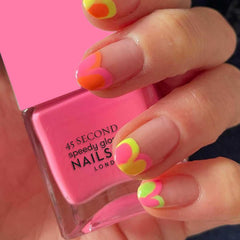 Nails Inc Taylor swatch on skin displaying true neon pink and opaque coverage