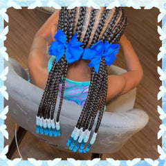 NAISKA beads threaded in braid on child hair for playful styling benefit
