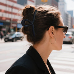 Nalodu transparent clip holding a full bun for strong hold benefit