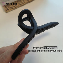 Nalodu clips in a purse flatlay, travel-friendly styling solution