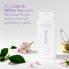 Native bottle on shower shelf in a modern bathroom suggesting everyday routine freshness