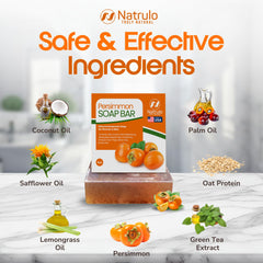 Natrulo persimmon bar beside persimmon and green tea leaves showing natural ingredients