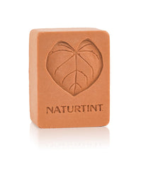 Naturtint bar close-up texture highlighting natural ingredients and creamy lather