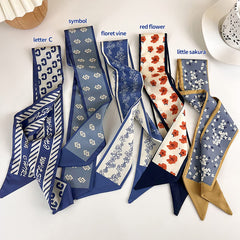 NCDUANSAN scarf draped over hand showing narrow compact size