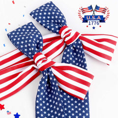 NCMAMA bow styled with patriotic outfit showing coordinated holiday appearance