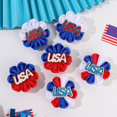 NCMAMA two-inch bow next to a coin to show size and easy wear for kids