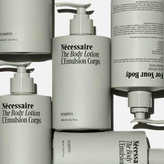 Nécessaire bottle pump and label detail highlighting ingredient transparency and use