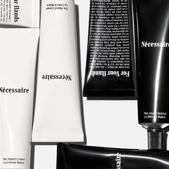 Nécessaire close-up of Hand Retinol balm texture showing creamy repair formula for nights