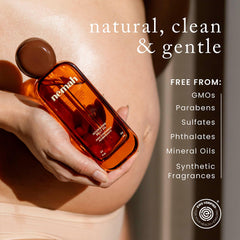Nemah applied on pregnant belly demonstrating smooth, non-greasy feel