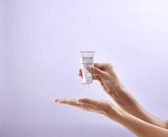 Neom hand balm texture close-up showing creamy blend for fast absorption