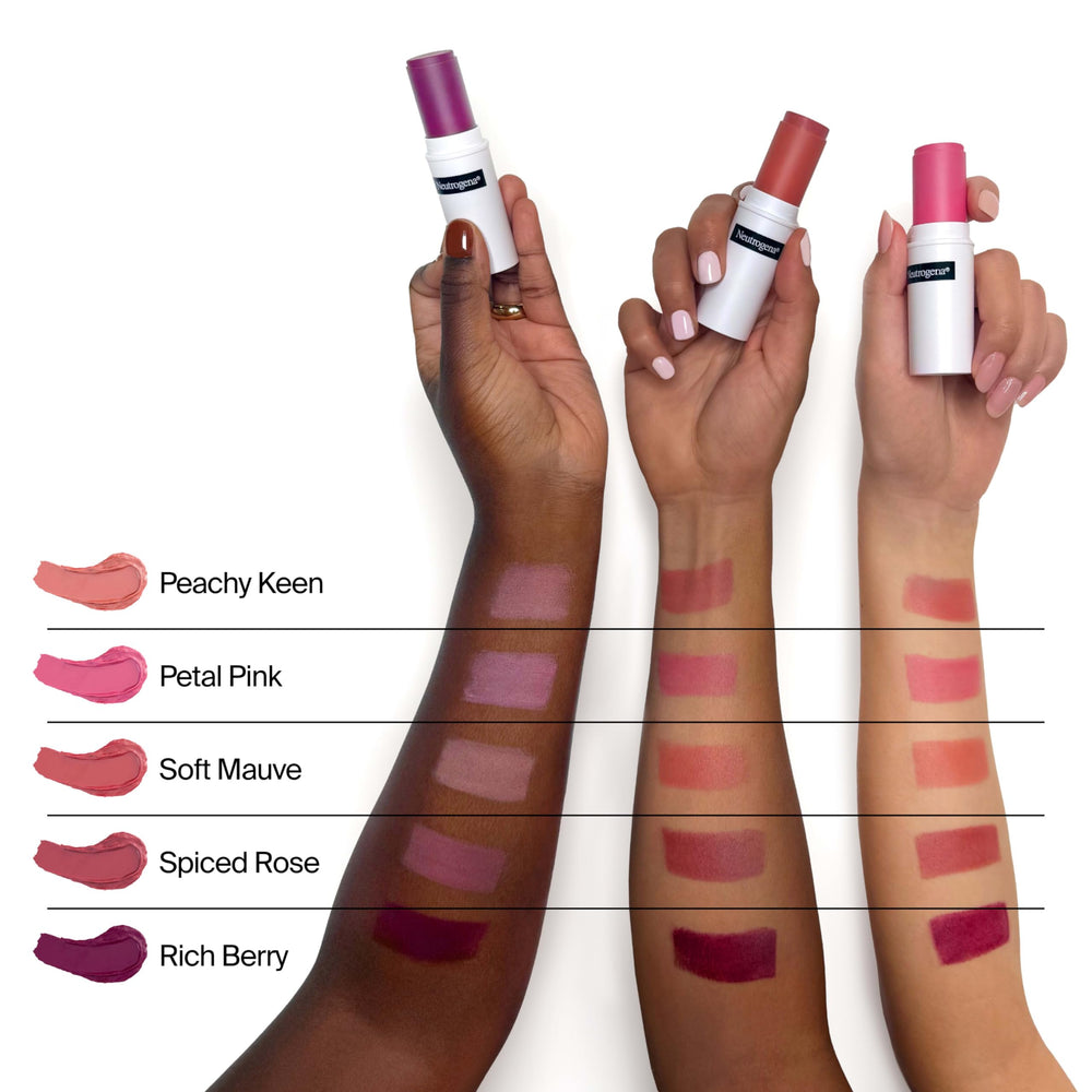 Neutrogena blush stick being blended with fingertip to demonstrate smooth finish