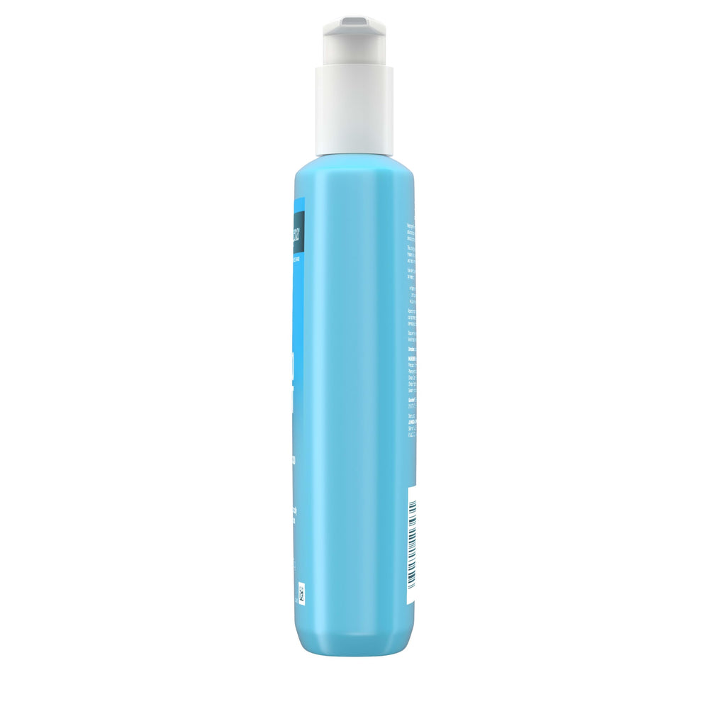 Neutrogena applying to elbow and knee to relieve dry patches