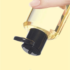 Neutrogena bottle beside bathtub illustrating bath oil use for soft skin