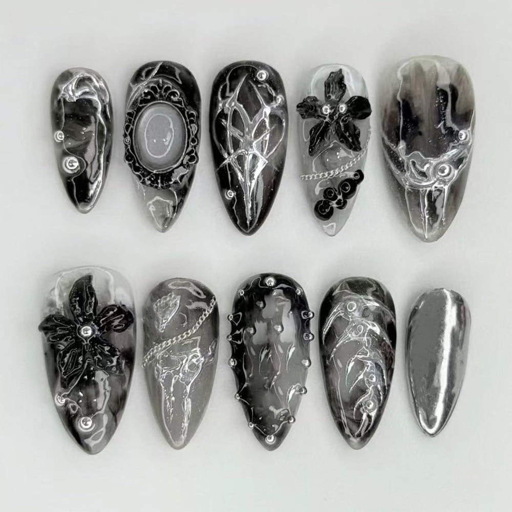 NEWSPIED front packaging showing 24-piece gothic press-on nails, ready-to-wear benefit